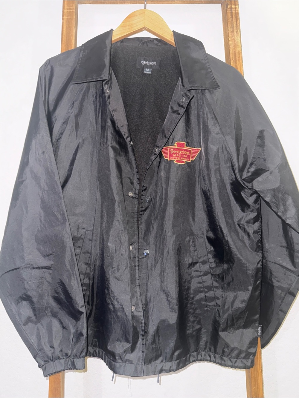 Brixton Black Windbreaker Jacket with Red Crest Patch